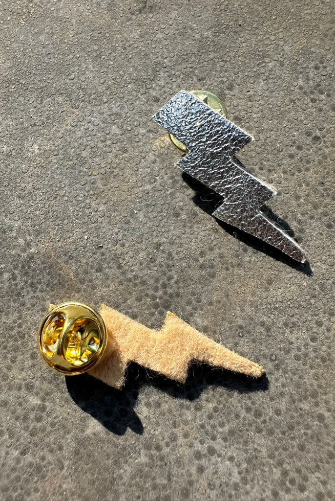 duo broches tonnerre or et argent