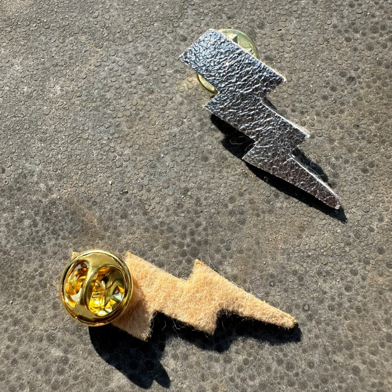 duo broches tonnerre or et argent